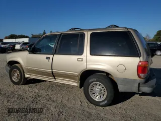 1999 Ford Explorer XL with VIN 1FMZU34X2XUA28059, listed as a Copart auction lot 77668294 with 131,064 mi miles and Salvage title. Bid and sale history available at DreamBid. Image 2.
