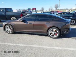2014 Tesla Model S 60 with VIN 5YJSA1H17EFP33275, listed as a IAAI auction lot 41778167 with 202,749 mi miles and . Bid and sale history available at DreamBid. Image 14.