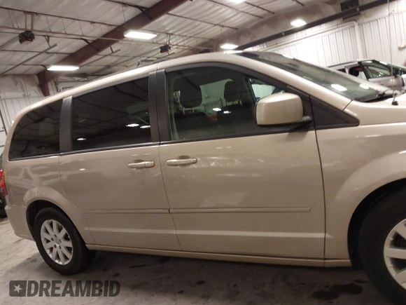 2013 Dodge Grand Caravan SXT with VIN 2C4RDGCG0DR567186, listed as a IAAI auction lot 41706119 with 112,512 mi miles and . Bid and sale history available at DreamBid. Image 14.