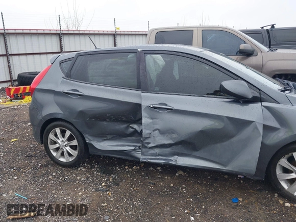 2012 Hyundai Accent SE with VIN KMHCU5AE9CU013458, listed as a IAAI auction lot 41475986 with 88,592 mi miles. Bid and sale history available at carsss.com. Image 6.