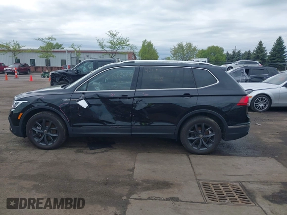 2024 Volkswagen Tiguan SE with VIN 3VVMB7AX7RM042855, listed as a IAAI auction lot 42223748 with 14,077 mi miles and . Bid and sale history available at DreamBid. Image 14.