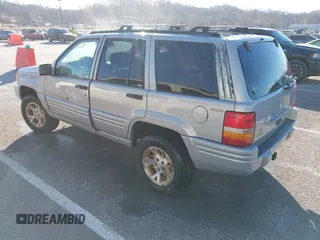1997 Jeep Grand Cherokee Limited with VIN 1J4GZ78Y8VC718435, listed as a IAAI auction lot 41405361 with 210,599 mi miles. Bid and sale history available at carsss.com. Image 3.