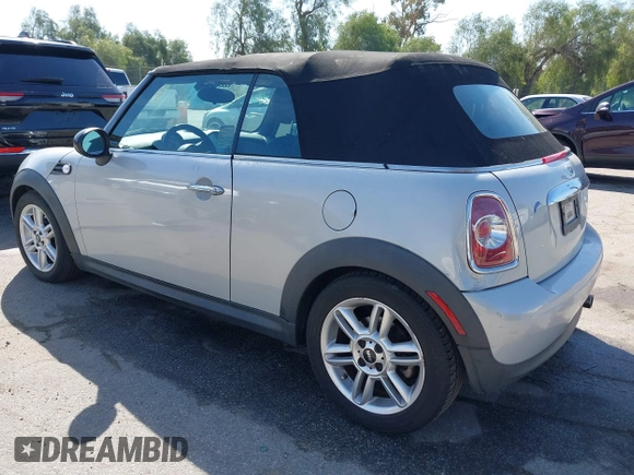 2011 MINI Convertible with VIN WMWZN3C57BT133094, listed as a IAAI auction lot 41711094 with 96,056 mi miles and . Bid and sale history available at DreamBid. Image 3.