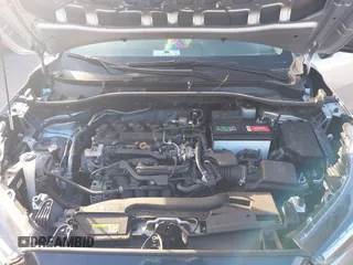 2022 Toyota Corolla Cross L with VIN 7MUAAAAG6NV010688, listed as a IAAI auction lot 41212520 with 50,075 mi miles and . Bid and sale history available at DreamBid. Image 10.