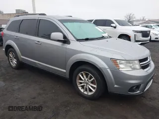 2016 Dodge Journey SXT with VIN 3C4PDDBG2GT242127, listed as a IAAI auction lot 41485555 with 119,728 mi miles. Bid and sale history available at carsss.com. Image 1.