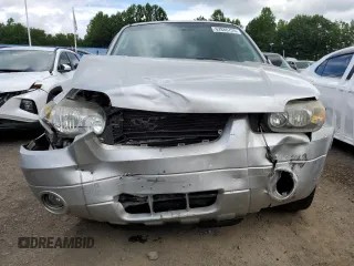 2005 Ford Escape Limited with VIN 1FMCU94165KA11181, listed as a Copart auction lot 62880725 with 180,152 mi miles and Salvage title. Bid and sale history available at DreamBid. Image 5.