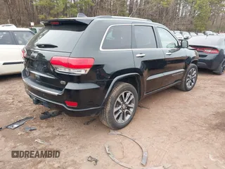 2017 Jeep Grand Cherokee Overland z VIN 1C4RJECG4HC878258, wystawiony jako IAAI lot #41361352 z przebiegiem 137 574 mil mil oraz . Historia ofert i sprzedaży dostępna na DreamBid. Obrazek 4.