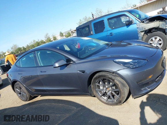 2023 Tesla Model 3 with VIN 5YJ3E1EA7PF447409, listed as a IAAI auction lot 41965416 with 40,033 mi miles and . Bid and sale history available at DreamBid. Image 13.