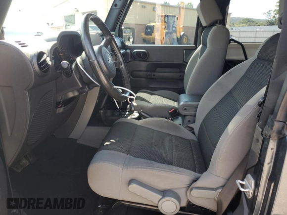 2007 Jeep Wrangler X with VIN 1J4FA24117L170294, listed as a Copart auction lot 64806715 with 132,130 mi miles and Salvage title. Bid and sale history available at DreamBid. Image 7.
