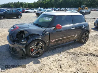 2013 MINI Hardtop John Cooper Works with VIN WMWSU9C54DT384990, listed as a Copart auction lot 56916795 with 96,678 mi miles and Salvage title. Bid and sale history available at DreamBid. Image 1.