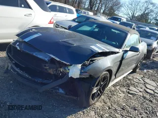 2021 Ford Mustang EcoBoost z VIN 1FATP8UH3M5105279, wystawiony jako IAAI lot #41712821 z przebiegiem 99 760 mil mil oraz . Historia ofert i sprzedaży dostępna na DreamBid. Obrazek 2.