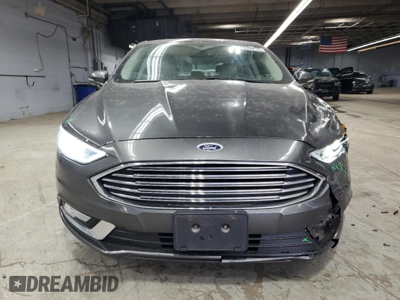 2017 Ford Fusion Titanium z VIN 3FA6P0SU3HR209563, wystawiony jako Copart lot #52039915 z przebiegiem 119 961 mil mil oraz Szkoda całkowita • Salvage title. Historia ofert i sprzedaży dostępna na DreamBid. Obrazek 5.