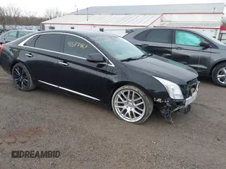 2014 Cadillac XTS Platinum with VIN 2G61W5S84E9291640, listed as a IAAI auction lot 41877867 with 100,462 mi miles and . Bid and sale history available at DreamBid. Image 1.
