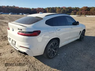 2021 BMW X4 M z VIN 5YMUJ0C00M9E94527, wystawiony jako Copart lot #69607414 z przebiegiem Nie podano mil oraz Szkoda całkowita • Salvage title. Historia ofert i sprzedaży dostępna na DreamBid. Obrazek 3.