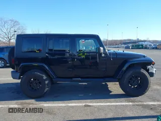 2010 Jeep Wrangler Unlimited Sahara with VIN 1J4HA5H16AL215659, listed as a IAAI auction lot 41749218 with 55,544 mi miles. Bid and sale history available at carsss.com. Image 13.