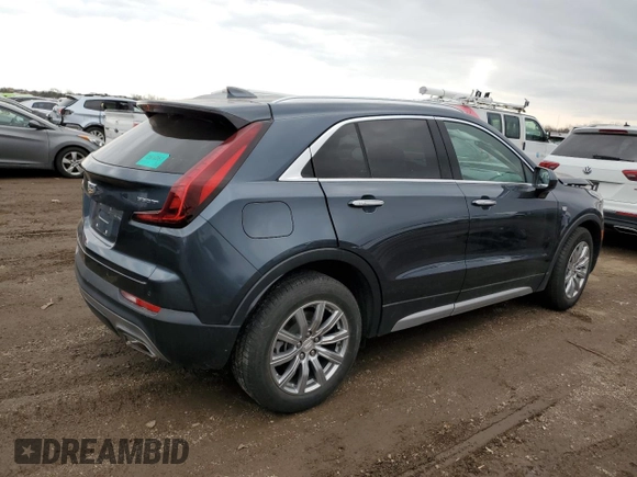 2020 Cadillac XT4 FWD Premium Luxury z VIN 1GYFZCR43LF050118, wystawiony jako Copart lot #49529635 z przebiegiem 93 290 mil mil oraz Tytuł czysty. Historia ofert i sprzedaży dostępna na DreamBid. Obrazek 3.