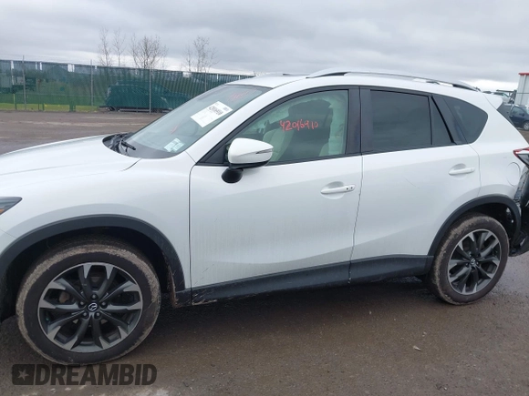 2016 Mazda CX-5 Grand Touring z VIN JM3KE4DY0G0705884, wystawiony jako IAAI lot #42016910 z przebiegiem 73 324 mil mil oraz . Historia ofert i sprzedaży dostępna na DreamBid. Obrazek 14.