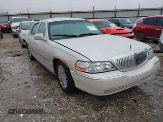 2004 Lincoln Town Car Ultimate z VIN 1LNHM83W34Y639871, wystawiony jako IAAI lot #41564935 z przebiegiem 78 452 mil mil oraz . Historia ofert i sprzedaży dostępna na DreamBid. Obrazek 1.
