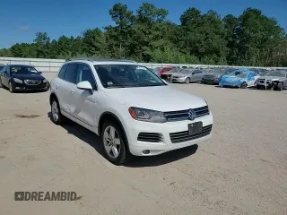 2014 Volkswagen Touareg Lux z VIN WVGEF9BP4ED011436, wystawiony jako Copart lot #74207144 z przebiegiem 207 059 mil mil oraz Szkoda całkowita • Salvage title. Historia ofert i sprzedaży dostępna na DreamBid. Obrazek 11.