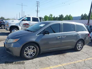 2011 Honda Odyssey EX-L with VIN 5FNRL5H64BB070836, listed as a IAAI auction lot 42520878 with 162,316 mi miles and . Bid and sale history available at DreamBid. Image 14.