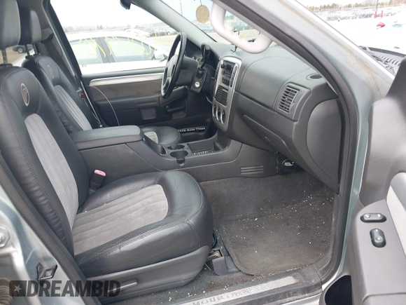 2005 Mercury Mountaineer Convenience z VIN 4M2ZU86K65UJ10015, wystawiony jako IAAI lot #42063970 z przebiegiem 153 542 mil mil oraz . Historia ofert i sprzedaży dostępna na DreamBid. Obrazek 5.