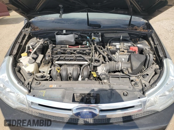 2008 Ford Focus SE z VIN 1FAHP35NX8W215744, wystawiony jako Copart lot #56096055 z przebiegiem 165 827 mil mil oraz Szkoda całkowita • Salvage title. Historia ofert i sprzedaży dostępna na DreamBid. Obrazek 11.