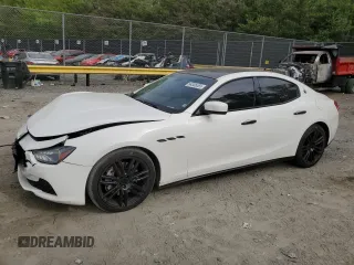 2015 Maserati Ghibli S Q4 with VIN ZAM57RTA9F1129928, listed as a Copart auction lot 54306065 with 74,747 mi miles and Salvage title. Bid and sale history available at DreamBid. Image 1.