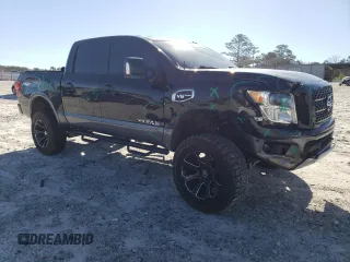 2017 Nissan Titan SV with VIN 1N6AA1E56HN541674, listed as a Copart auction lot 49463325 with 114,520 mi miles and Salvage Title. Bid and sale history available at DreamBid. Image 4.