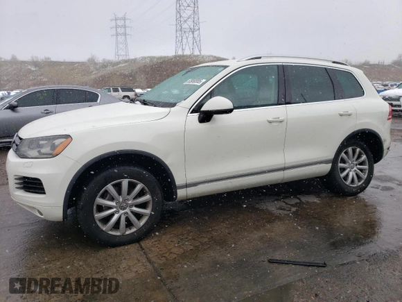 2011 Volkswagen Touareg Sport with VIN WVGFF9BP8BD002982, listed as a Copart auction lot 53958555 with 156,742 mi miles and Salvage Title. Bid and sale history available at DreamBid. Image 1.