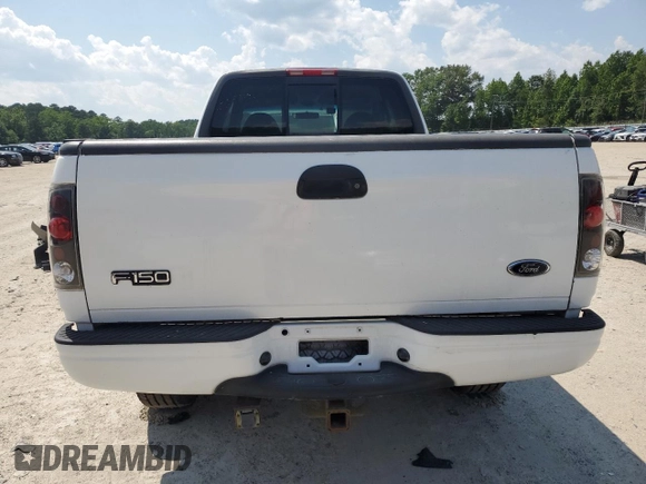 2000 Ford F-150 XL z VIN 1FTRX18L0YNA65615, wystawiony jako Copart lot #58508375 z przebiegiem Nie podano mil oraz Szkoda całkowita • Salvage title. Historia ofert i sprzedaży dostępna na DreamBid. Obrazek 6.