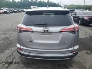 2018 Toyota RAV4 XLE with VIN 2T3RFREV8JW741461, listed as a Copart auction lot 57728244 with 88,925 mi miles and Salvage Title. Bid and sale history available at DreamBid. Image 6.