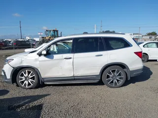 2021 Honda Pilot Touring 8-Passenger with VIN 5FNYF6H92MB031782, listed as a IAAI auction lot 42087322 with 70,062 mi miles and . Bid and sale history available at DreamBid. Image 14.