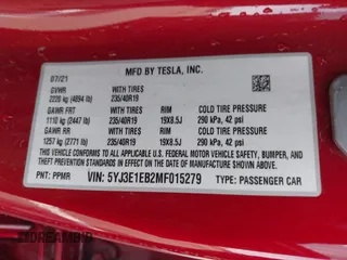 2021 Tesla Model 3 Long Range with VIN 5YJ3E1EB2MF015279, listed as a IAAI auction lot 41765428 with 55,486 mi miles. Bid and sale history available at carsss.com. Image 9.