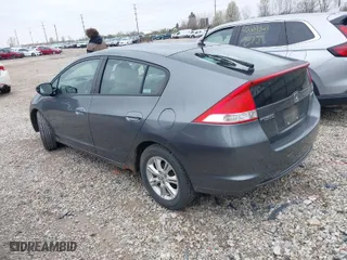 2010 Honda Insight EX with VIN JHMZE2H7XAS024879, listed as a IAAI auction lot 42029553 with 187,648 mi miles. Bid and sale history available at carsss.com. Image 3.