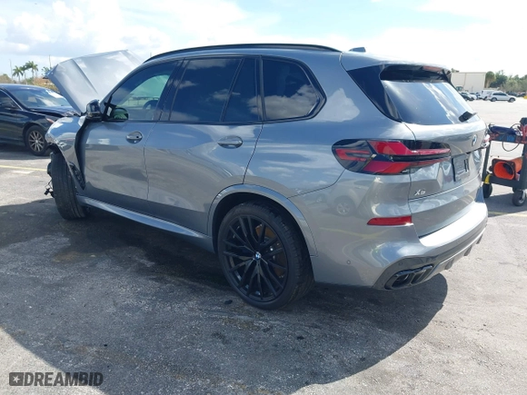 2025 BMW X5 M60i with VIN 5UX33EU03S9X62019, listed as a IAAI auction lot 41623189 with 5,749 mi miles. Bid and sale history available at carsss.com. Image 3.