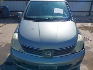 2009 Nissan Versa 1.8 SL with VIN 3N1BC13E19L372298, listed as a IAAI auction lot 42011338 with 131,882 mi miles. Bid and sale history available at carsss.com. Image 13.