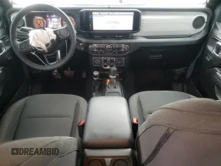 2024 Jeep Wrangler Sport S with VIN 1C4PJXDG1RW305304, listed as a Copart auction lot 57555635 with 5,705 mi miles and Salvage title. Bid and sale history available at DreamBid. Image 8.