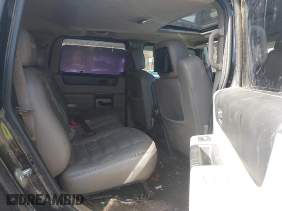2003 Hummer H2 with VIN 5GRGN23U33H144379, listed as a IAAI auction lot 41452982 with 227,746 mi miles. Bid and sale history available at carsss.com. Image 8.