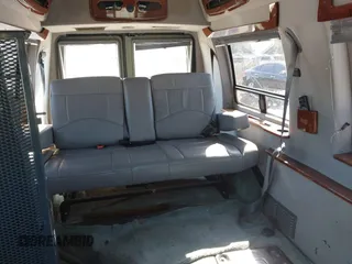 1999 Ford Econoline Cargo with VIN 1FDRE14W2XHB18989, listed as a IAAI auction lot 41740961 with 152,028 mi miles. Bid and sale history available at carsss.com. Image 8.