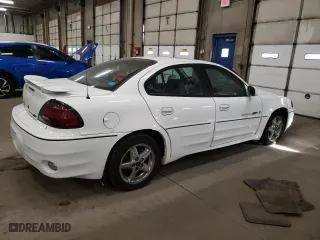 2001 Pontiac Grand Am GT1 with VIN 1G2NV52EX1C228458, listed as a Copart auction lot 76138094 with 118,833 mi miles and Clean Title. Bid and sale history available at carsss.com. Image 3.