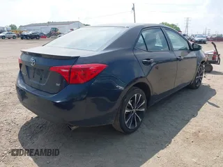 2018 Toyota Corolla L with VIN 2T1BURHE1JC111066, listed as a IAAI auction lot 42215074 with 106,677 mi miles and . Bid and sale history available at DreamBid. Image 4.