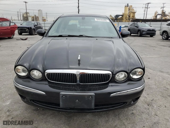 2002 Jaguar X-Type with VIN SAJEA51C02WC46124, listed as a Copart auction lot 50656395 with 50,815 mi miles and Salvage Title. Bid and sale history available at carsss.com. Image 5.