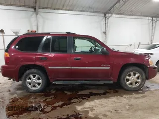 2006 GMC Envoy SLT with VIN 1GKDS13S362135683, listed as a IAAI auction lot 41477501 with 214,760 mi miles. Bid and sale history available at carsss.com. Image 13.