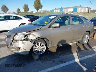 2009 Toyota Corolla with VIN 1NXBU40E59Z164488, listed as a IAAI auction lot 40907058 with 180,161 mi miles. Bid and sale history available at carsss.com. Image 2.