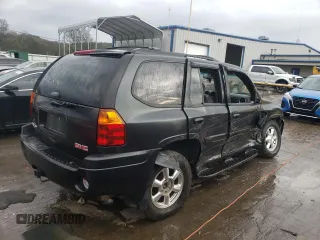 2004 GMC Envoy SLT with VIN 1GKDT13S042310076, listed as a Copart auction lot 79965854 with 220,506 mi miles and Salvage Title. Bid and sale history available at carsss.com. Image 3.
