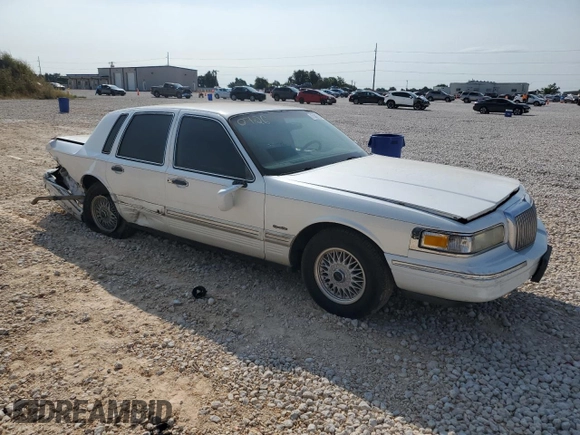 1997 Lincoln Town Car Signature z VIN 1LNLM82W9VY681894, wystawiony jako Copart lot #71467034 z przebiegiem 129 142 mil mil oraz Szkody całkowita. Historia ofert i sprzedaży dostępna na DreamBid. Obrazek 4.
