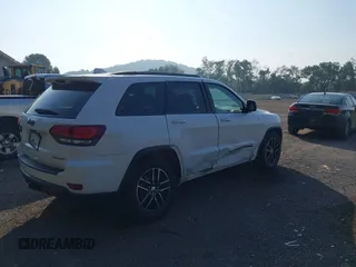 2017 Jeep Grand Cherokee Trailhawk with VIN 1C4RJFLG2HC670868, listed as a IAAI auction lot 42711041 with 129,465 mi miles and . Bid and sale history available at DreamBid. Image 4.