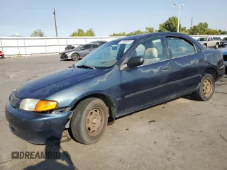 1998 Mazda Protege DX with VIN JM1BC1417W0215067, listed as a Copart auction lot 75000044 with 233,009 mi miles and Salvage Title. Bid and sale history available at DreamBid. Image 1.