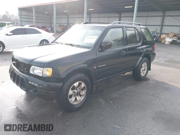 2000 Isuzu Rodeo S with VIN 4S2CK58W0Y4342408, listed as a IAAI auction lot 41659468 with 173,096 mi miles. Bid and sale history available at carsss.com. Image 2.