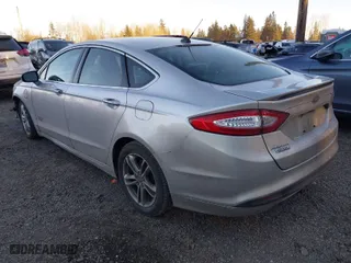 2015 Ford Fusion Energi Titanium with VIN 3FA6P0SU8FR264846, listed as a IAAI auction lot 41552443 with 160,142 mi miles. Bid and sale history available at carsss.com. Image 3.